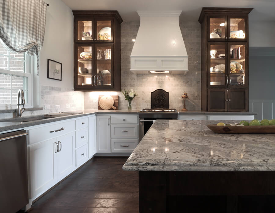 Kitchen with stained cabinets and white cabinets